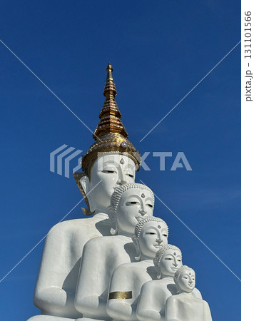white buddha statues with clear blue sky 131101566