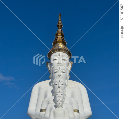 white buddha statues with clear blue sky 131101567