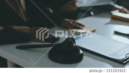 Lawyer explained to the client about the law that must be brought against the court case. Lawyer explained to the client about the law that must be brought against the court case. 131101922