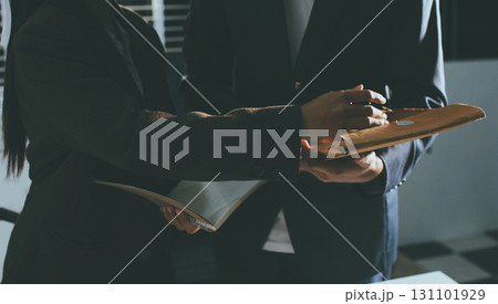 Lawyer explained to the client about the law that must be brought against the court case. Lawyer explained to the client about the law that must be brought against the court case. 131101929