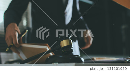 Lawyer explained to the client about the law that must be brought against the court case. Lawyer explained to the client about the law that must be brought against the court case. 131101930