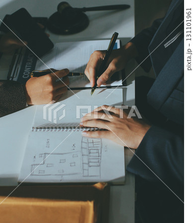 Lawyer explained to the client about the law that must be brought against the court case. Lawyer explained to the client about the law that must be brought against the court case. 131101961