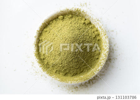 Top view of matcha green tea powder in bowl on white background Top view of matcha green tea powder in bowl on white background 131103786