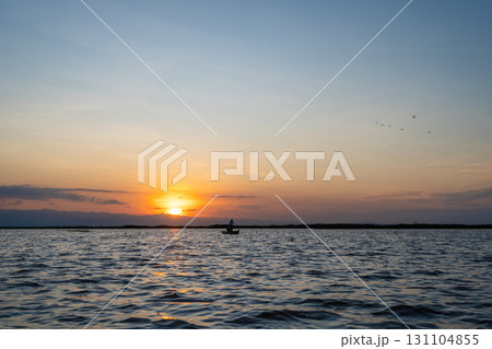 Boat at sunset on Lake Tempe, Sulawesi, Indonesia Boat at sunset on Lake Tempe, Sulawesi, Indonesia 131104855