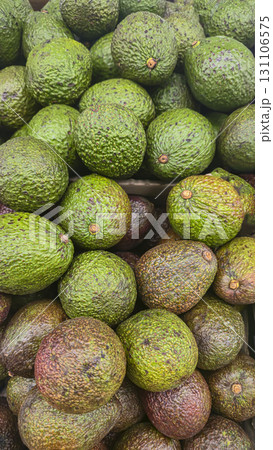 Avocados in large crates on store shelves. Fruit display and sale. Avocados in large crates on store shelves. Fruit display and sale. 131106575