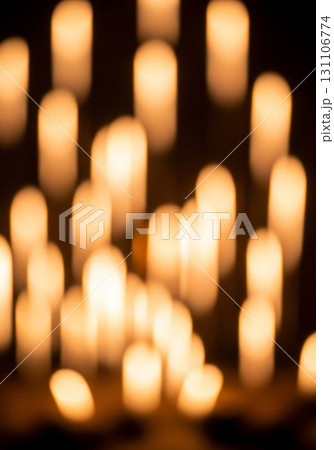 Blurred Warm Bokeh Lights on Dark Background Creates Abstract Festive Mood 131106774