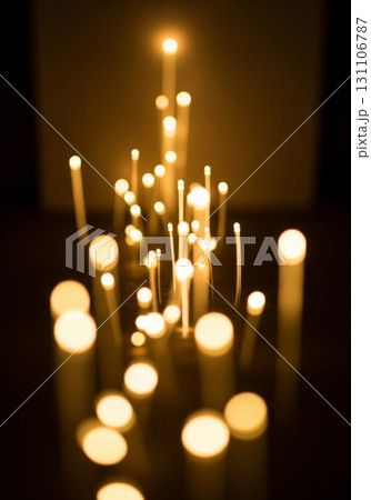 Illuminated Fiber Optic Strands Creating Bokeh Effect Against Dark Background 131106787