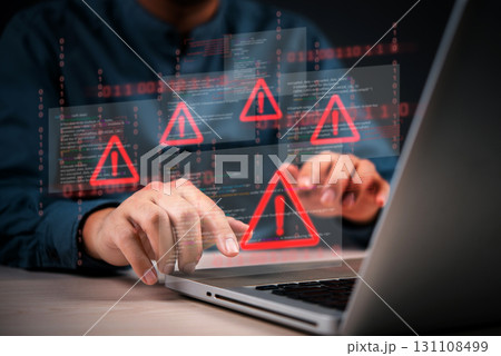 Cybersecurity warning with coding glitch and malware alert shown on digital interface, representing data breach and system vulnerability.Hacking attempt detected with virus icons on computer screen. Cybersecurity warning with coding glitch and malware alert shown on digital interface, representing data breach and system vulnerability.Hacking attempt detected with virus icons on computer screen. 131108499