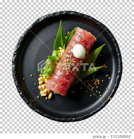 Diced Yellowfin Tuna Tartare Shaped into a Cylinder with Avocado and Nori Crisps on a Black Plate Diced Yellowfin Tuna Tartare Shaped into a Cylinder with Avocado and Nori Crisps on a Black Plate 131108802
