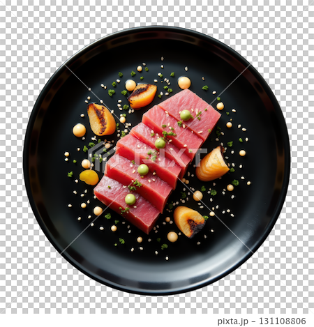 Elegant Presentation of Lightly Seared Tuna Slices with Ponzu Sauce and Garnishes on a Black Plate 131108806