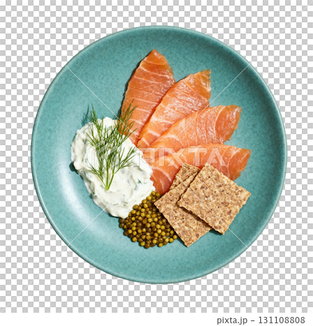 Delicious Garnished Salmon Gravlax with Dill Cream, Pickled Mustard Seeds, and Rye Crisps on a Vibrant Plate 131108808
