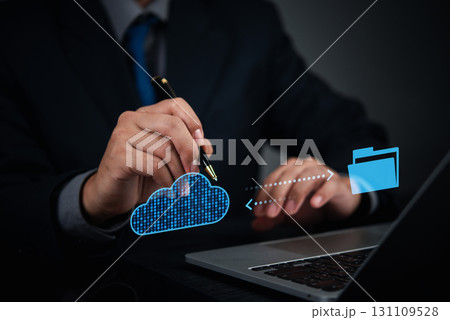 Businessman using cloud technology to transfer files to secure digital storage, concept for cloud computing solution and data backup. online management. 131109528