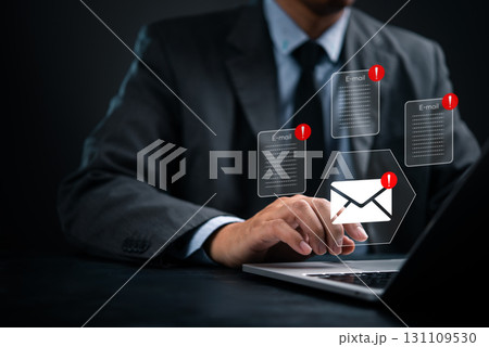 Email warning icons popping up on computer screen, representing inbox overload and phishing alert. Email spam alert and cybersecurity concept, digital communication, spam risk, or email marketing Email warning icons popping up on computer screen, representing inbox overload and phishing alert. Email spam alert and cybersecurity concept, digital communication, spam risk, or email marketing 131109530