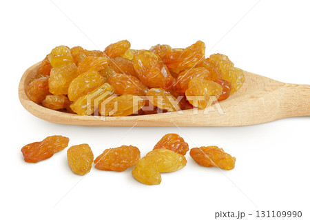 Yellow Raisins in wooden spoon isolated on white background. Yellow Raisins in wooden spoon isolated on white background. 131109990
