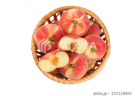 chinese flat donut peaches in a wicker basket isolated on white background. Top view. Flat lay 131110003