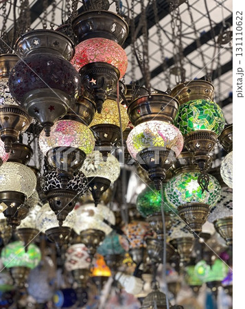 Colorful mosaic lamps hanging from indoor ceiling in Turkish market, rich cultural ornamentation 131110622