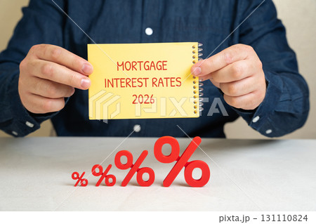 Notes mortgage interest rates 2026 in businessman's hands and percent signs on table. Loan and credit interest. Apartments, housing, house. Real estate market analysis concept. Business and finance Notes mortgage interest rates 2026 in businessman's hands and percent signs on table. Loan and credit interest. Apartments, housing, house. Real estate market analysis concept. Business and finance 131110824