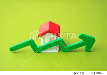 Bank building and green up arrow. Growth of savings in the bank account. Rising bank capitalization, deposit growth, increasing consumer savings. Business and finance 131110828