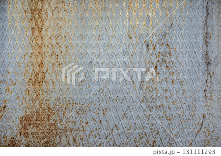 Texture of a ribbed, rusty metal surface with a diamond pattern Texture of a ribbed, rusty metal surface with a diamond pattern 131111293