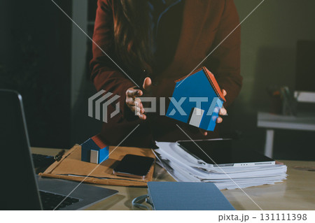 Customer signing a real estate contract in real estate agency. 131111398