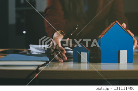 Customer signing a real estate contract in real estate agency. Customer signing a real estate contract in real estate agency. 131111400