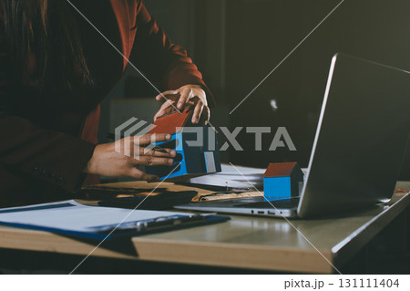 Customer signing a real estate contract in real estate agency. Customer signing a real estate contract in real estate agency. 131111404