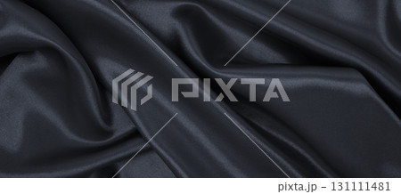 Smooth elegant dark grey silk or satin luxury cloth texture as abstract background. Luxurious background design 131111481