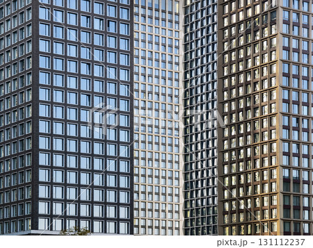 Modern buildings showcasing various architectural styles and materials in an urban cityscape during daytime hours 131112237