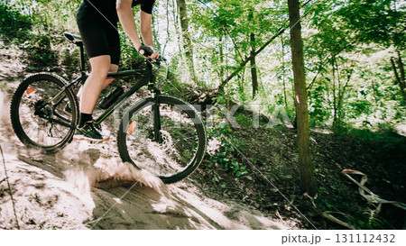 Mountain Bike cyclist riding track at sunny day, healthy lifestyle active athlete doing sport 131112432