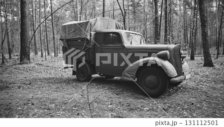 German Vehicle Truck Opel Blitz In Forest. Sunny Autumn Day. Military Truck Opel. German Wehrmacht World War Ii Military Automotive. Autumn Season Nature. Reenactment Tactic Game. Black And White 131112501