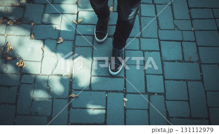 Man walking on city sidewalk dramatic effect 131112979