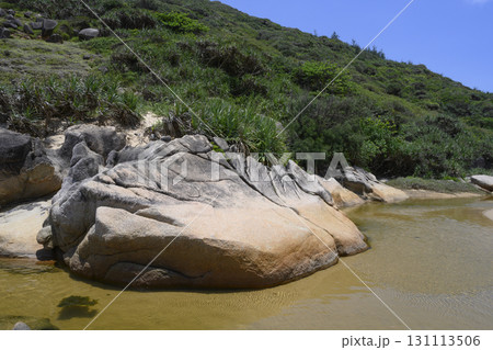 A huge rock in a stream near a mountain in Vietnam A huge rock in a stream near a mountain in Vietnam 131113506