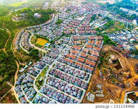 Aerial view of residential houses and driveways neighborhood during a fall sunset or sunrise time.Tightly packed homes.Top view over building houses in phuket thailand 131114466