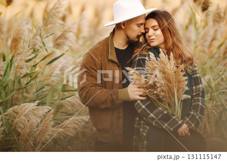 Lovely hipster couple enjoying each other in the autumn park. Nice autumn day. love and lifestyle. 131115147