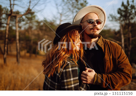 Lovely hipster couple enjoying each other in the autumn park. Nice autumn day. love and lifestyle. 131115150