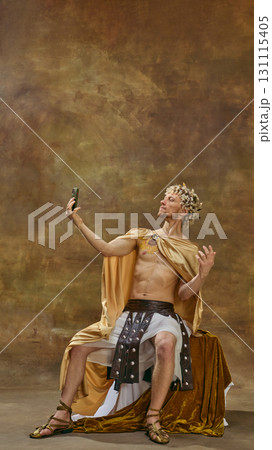 Man in Caesar costume posing for selfie with theatrical dramatic posture 131115405