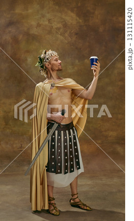 Man in toga with sword holding modern disposable cup in admiration Man in toga with sword holding modern disposable cup in admiration 131115420