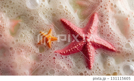 Two starfishes with tiny bubbles resting on a tropical beach, showcasing marine beauty, peaceful nature, and vacation vibes through a relaxing coastal scene of the natural seaside 131115605
