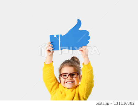 appy child holding blue like symbol thumbs up sign on white background 131116302