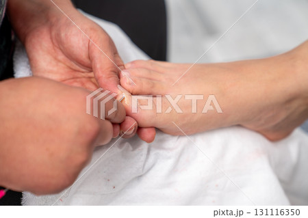 Professional pedicure treatment with toenail care 131116350
