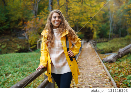 Portrait of young woman walking in the forest. Travelling, lifestyle, adventure. Portrait of young woman walking in the forest. Travelling, lifestyle, adventure. 131116398