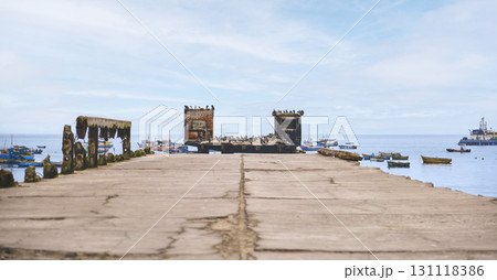 A pier with a few boats docked in the water, Chancay Lima, Peru. 131118386