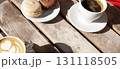 Coffee and macaroons on the wooden table. Coffee shop frame with copy space. 131118505