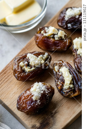 Gourmet stuffed dates with cheese and salt served as appetizer 131119027