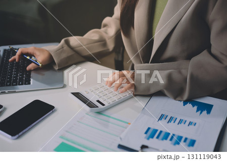 Portrait of young Hispanic professional business woman standing in office. Happy female company executive, smiling businesswoman entrepreneur corporate leader manager looking at camera using tablet Portrait of young Hispanic professional business woman standing in office. Happy female company executive, smiling businesswoman entrepreneur corporate leader manager looking at camera using tablet 131119043