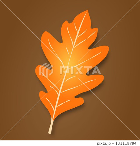 The autumn leaf is orange-yellow in color with light streaks and shadows on a brown background. The autumn leaf is orange-yellow in color with light streaks and shadows on a brown background. 131119794