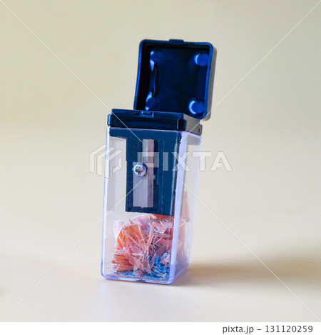 Black pencil-sharpener on a over color background. Black pencil-sharpener on a over color background. 131120259