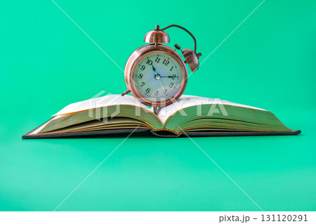 Alarm clock on the book.Time for knowledge. 131120291