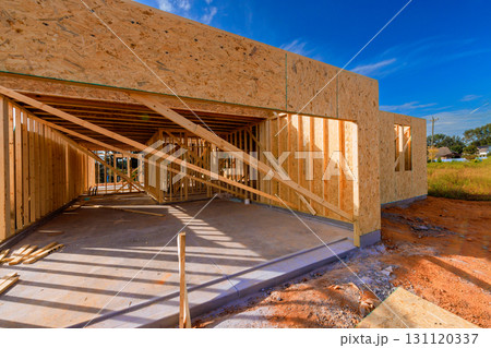 Wooden frames are being set up for new house under work day in residential area Wooden frames are being set up for new house under work day in residential area 131120337