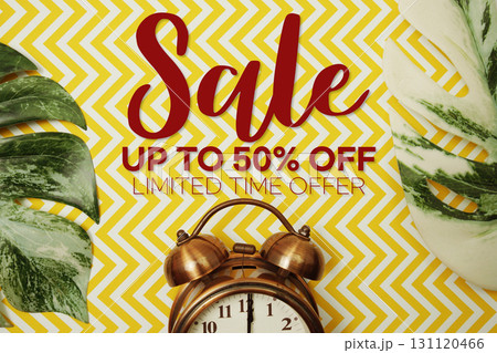 Sale 50% Off text with alarm clock on yellow background Sale 50% Off text with alarm clock on yellow background 131120466